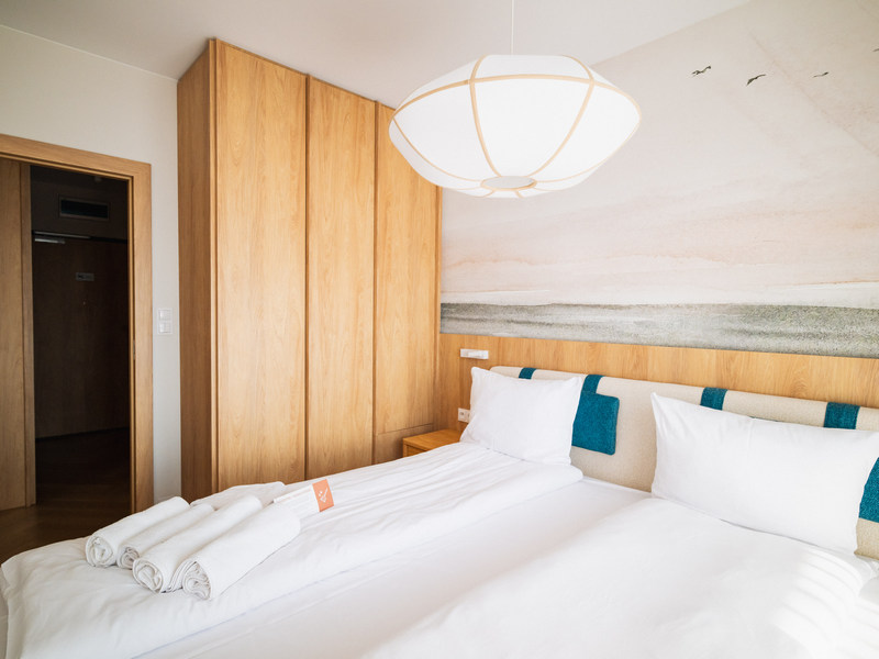 Sypialnia w apartamencie w ESSENSE Baltic Resort & SPA Dziwnów